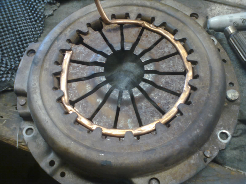 Springs must be compressed during removal. We didn’t do a very good job of that here, but managed to wrestle it out anyway. We’ll be more careful putting in the new parts.